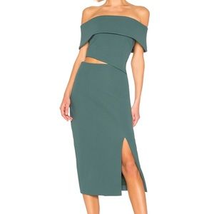 Green asymmetrical dress with waist cut outs